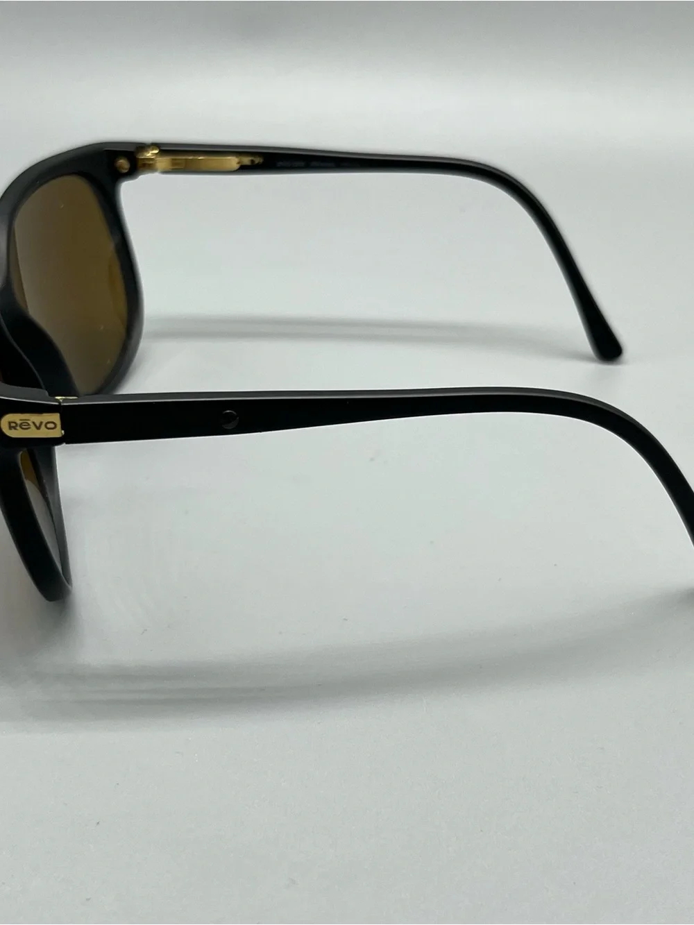 Revo Matte Black Sunglasses with Purple Mirrored Lenses